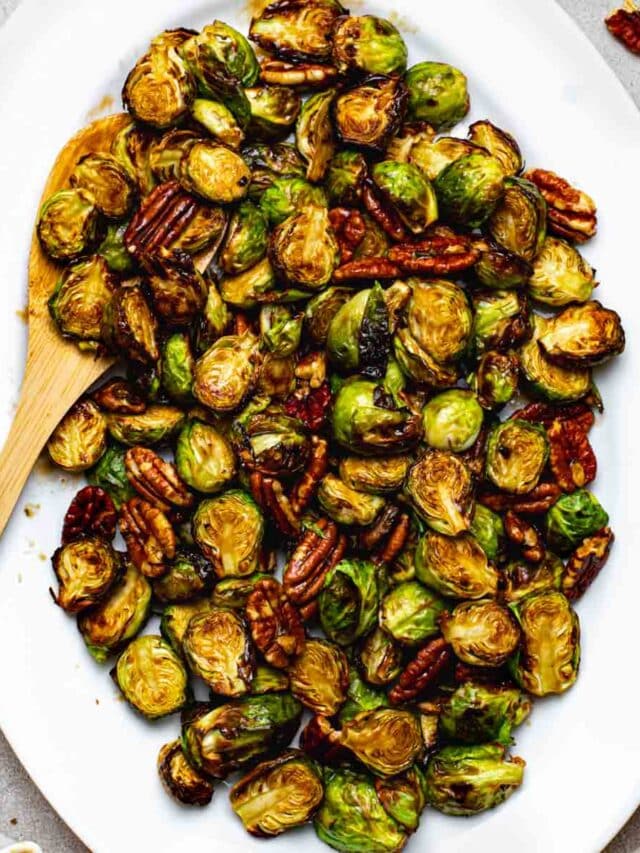 Crispy maple balsamic brussels sprouts on a serving platter.