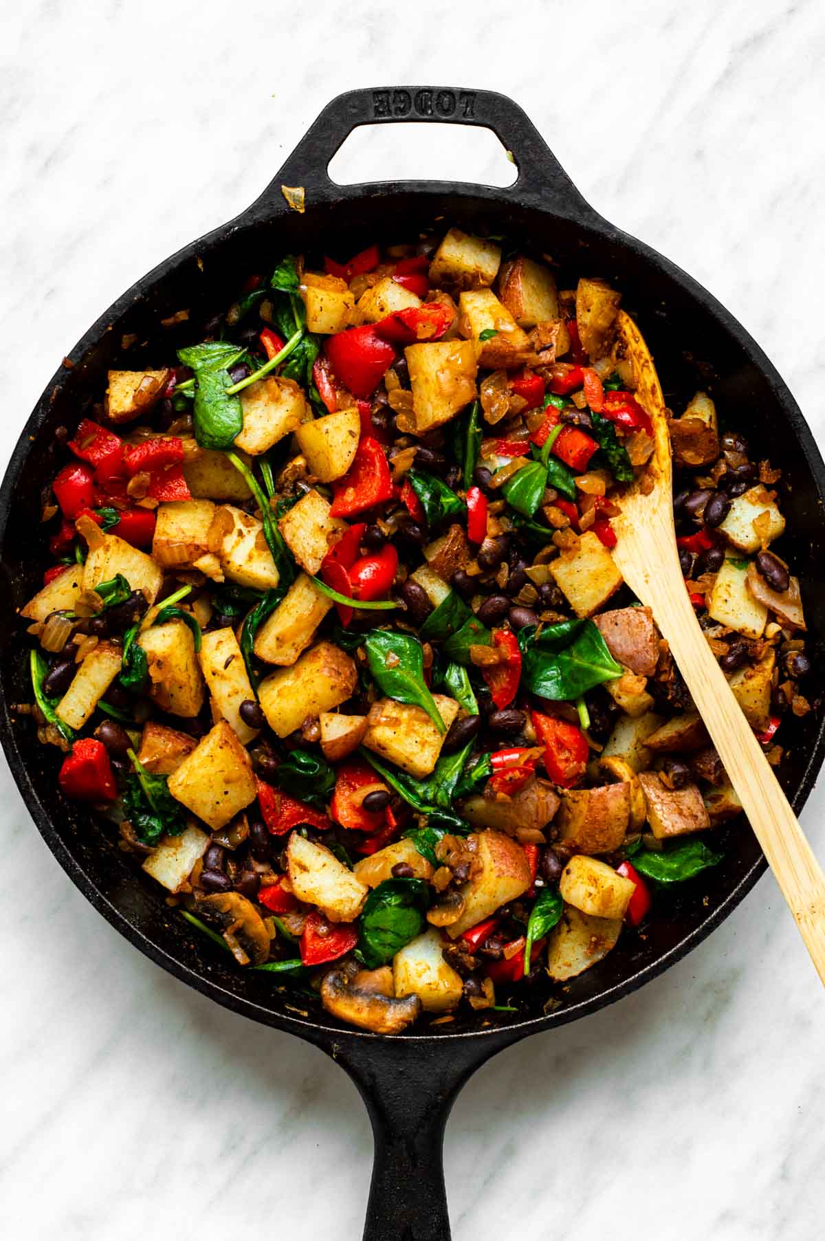 The finish vegetable hash in a skillet.