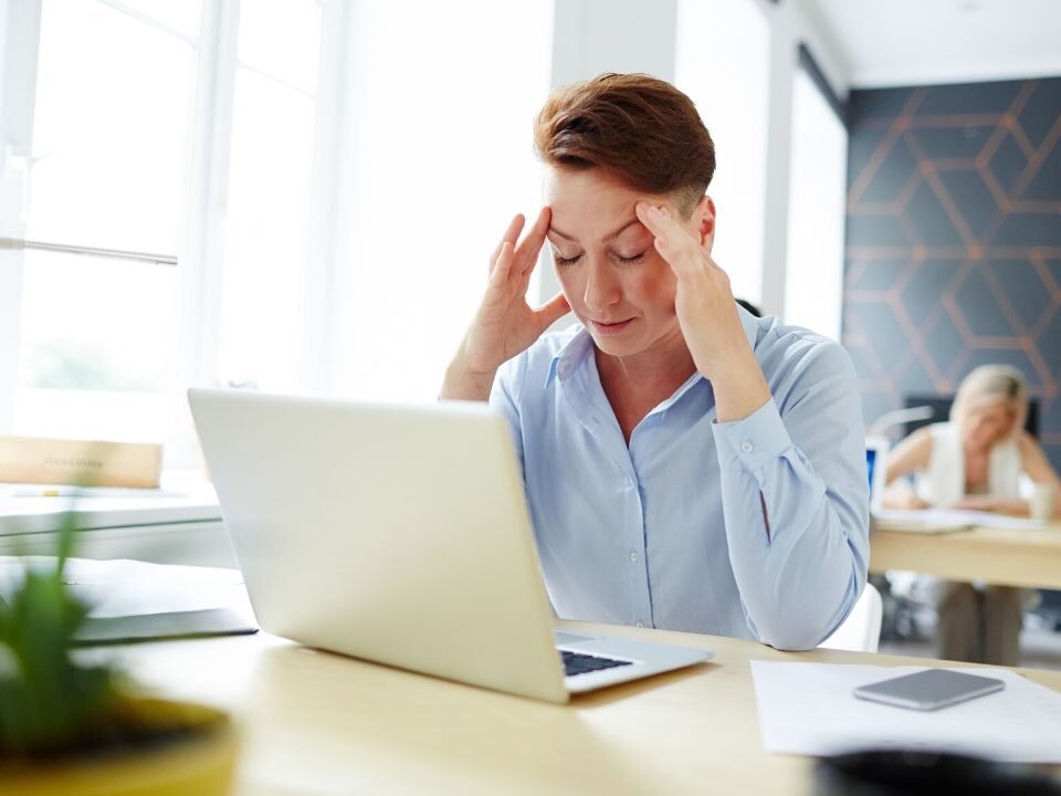 Person at a desk trying to concentrate