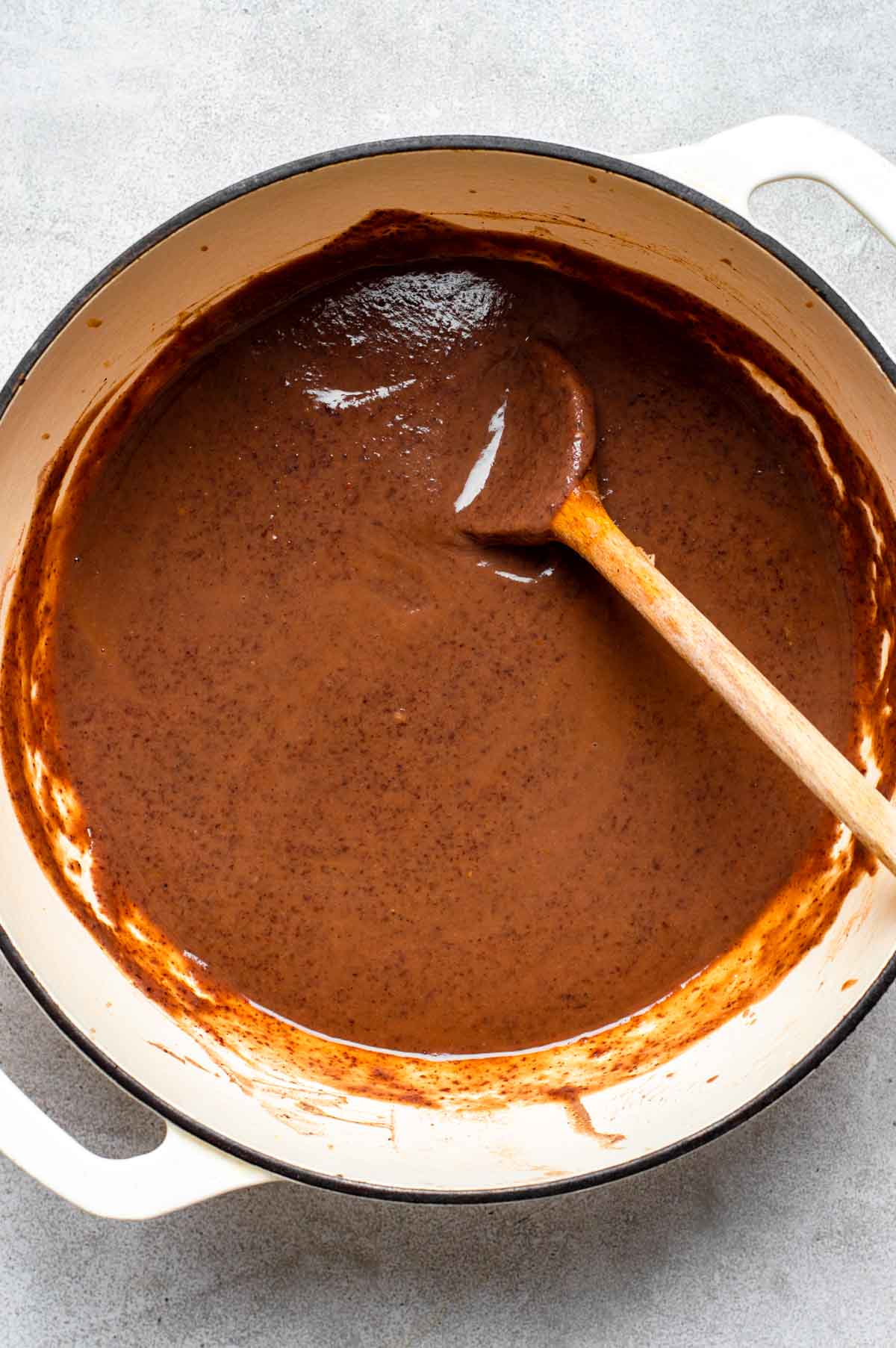 Black bean sauce mixture heating in a large pan.