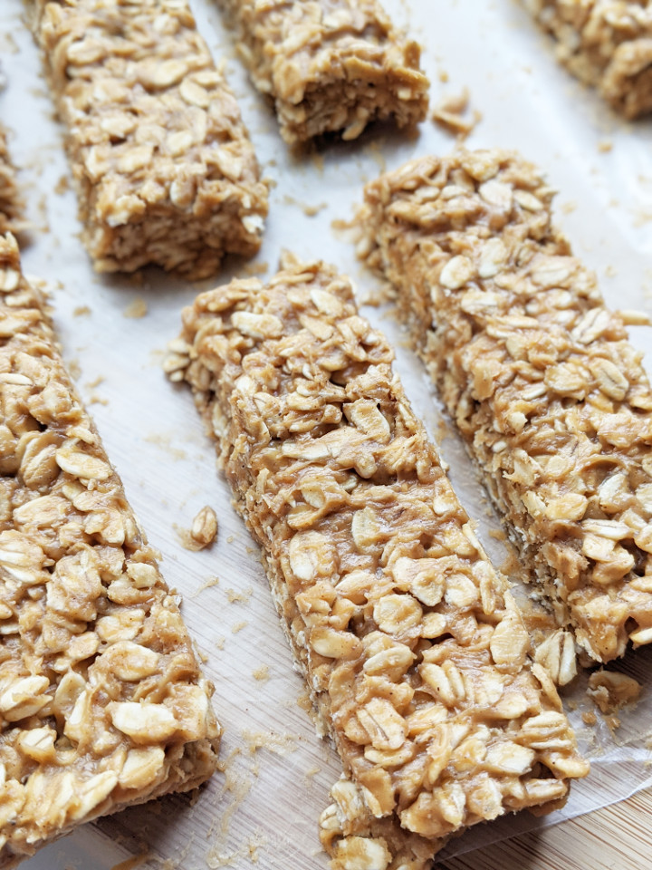 Just 5 ingredients and 5 minutes to whip these up. These bars are so easy to make, you'll never buy store-bought granola bars again. They are very filling, boasting 9g of protein using only whole food ingredients, and are vegan and gluten free! #granolabar #vegansnack #easysnack #vegan #glutenfree #healthysnack