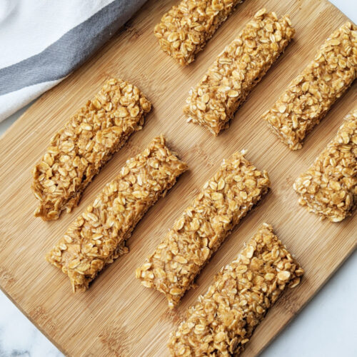 Just 5 ingredients and 5 minutes to whip these up. These bars are so easy to make, you'll never buy store-bought granola bars again. They are very filling, boasting 9g of protein using only whole food ingredients, and are vegan and gluten free! #granolabar #vegansnack #easysnack #vegan #glutenfree #healthysnack