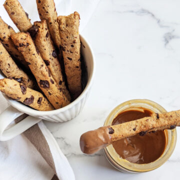 Vegan cookie fries with chocolate peanut butter dip! These chocolate chip cookie fries are crunchy on the outside with a soft chewy center. Perfect for dipping! Cookie fries recipe | Plant Based Cookie Fries #vegandessert #vegancookies #vegancookierecipe