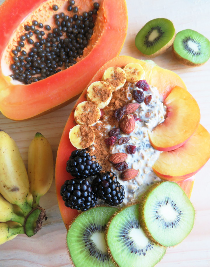 Papaya boats are a delicious and fun way to eat papayas. Fill your papaya up with overnight oats and fresh fruit for a truly tasty and filling breakfast. It's also easy to make and incredibly healthy! This breakfast is a delicious whole food plant based vegan breakfast or snack. #papaya #veganbreakfast #breakfastbowl #healthybreakfast #glutenfree #brunchrecipe #vegan #plantbased 