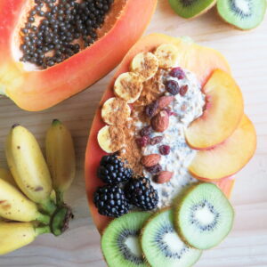 Papaya boats are a delicious and fun way to eat papayas. Fill your papaya up with overnight oats and fresh fruit for a truly tasty and filling breakfast. It's also easy to make and incredibly healthy! This breakfast is a delicious whole food plant based vegan breakfast or snack. #papaya #veganbreakfast #breakfastbowl #healthybreakfast #glutenfree #brunchrecipe #vegan #plantbased