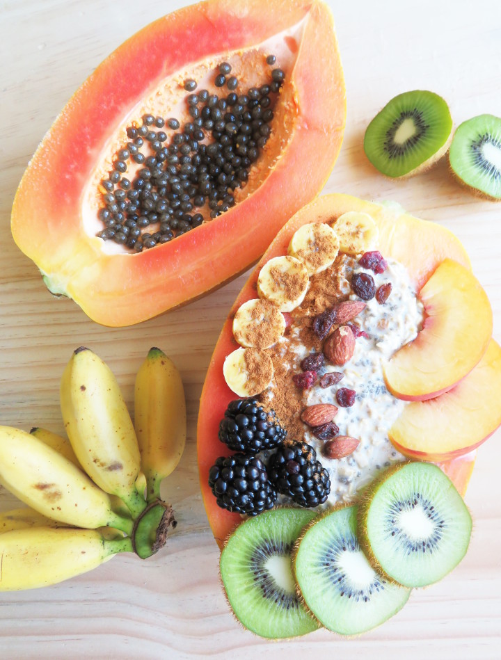 Papaya boats are a delicious and fun way to eat papayas. Fill your papaya up with overnight oats and fresh fruit for a truly tasty and filling breakfast. It's also easy to make and incredibly healthy! This breakfast is a delicious whole food plant based vegan breakfast or snack. #papaya #veganbreakfast #breakfastbowl #healthybreakfast #glutenfree #brunchrecipe #vegan #plantbased 