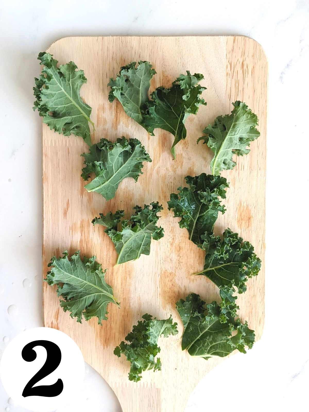 Chopped kale leaves on a cutting board.