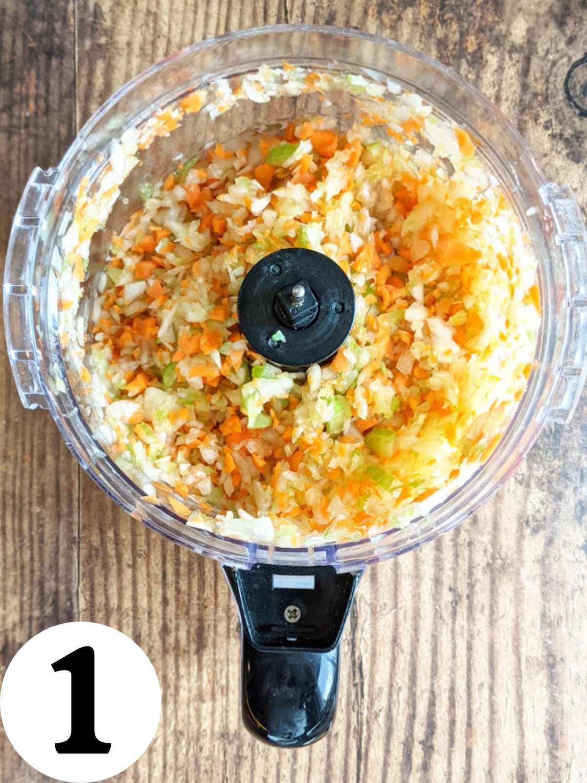 Chopped vegetables in a food processor.