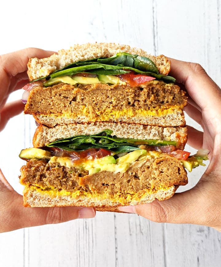 Overhead shot of someone holding two BBQ Seitan Sandwiches