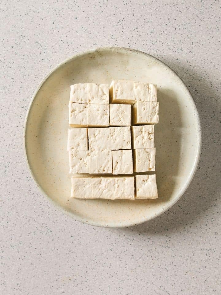 Cubes of firm tofu on a plate