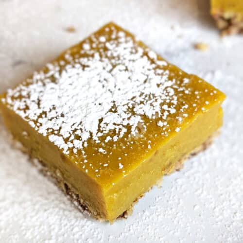 Lemon square topped with powdered sugar