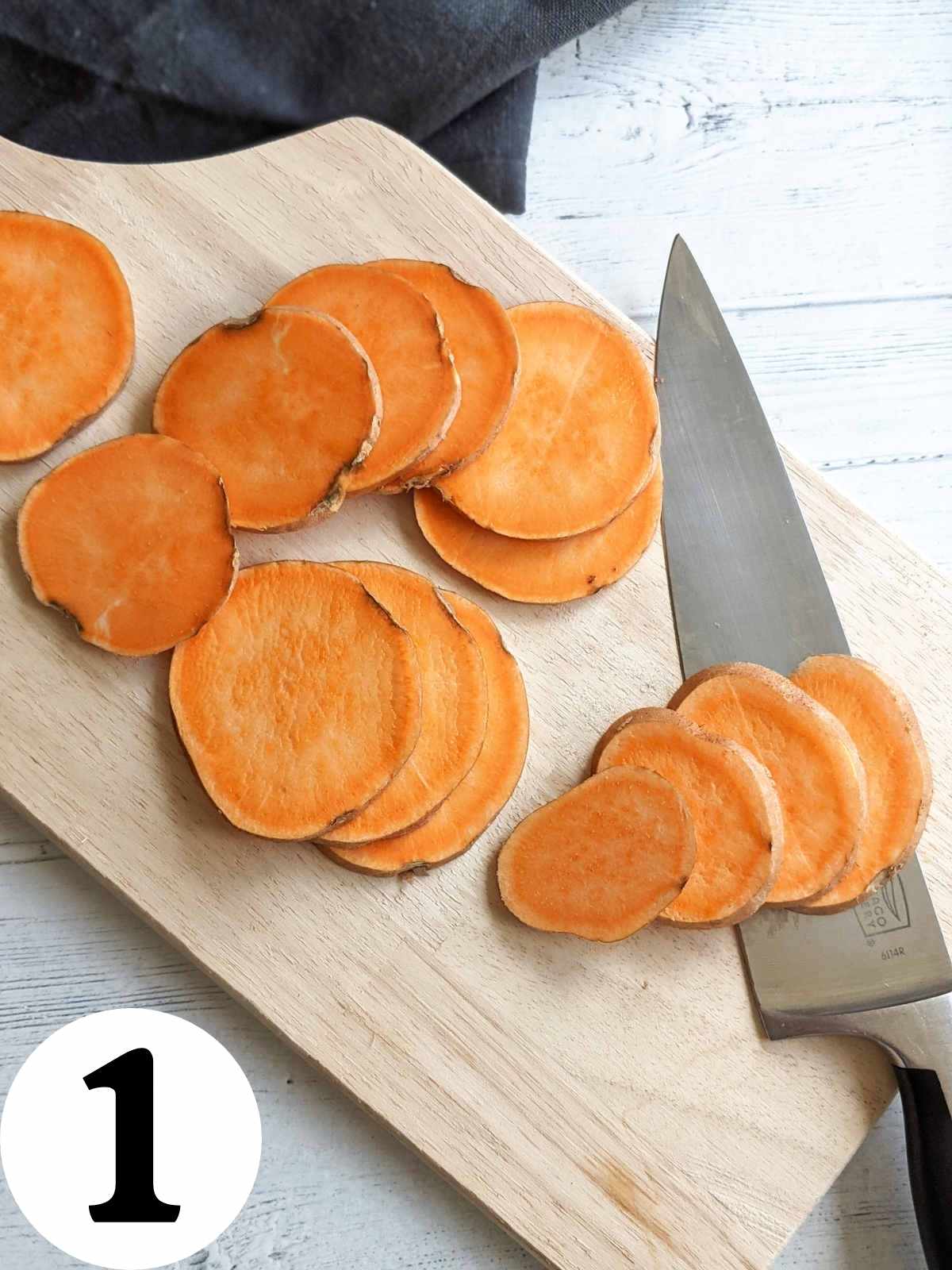 Sliced sweet potato on a cutting board.