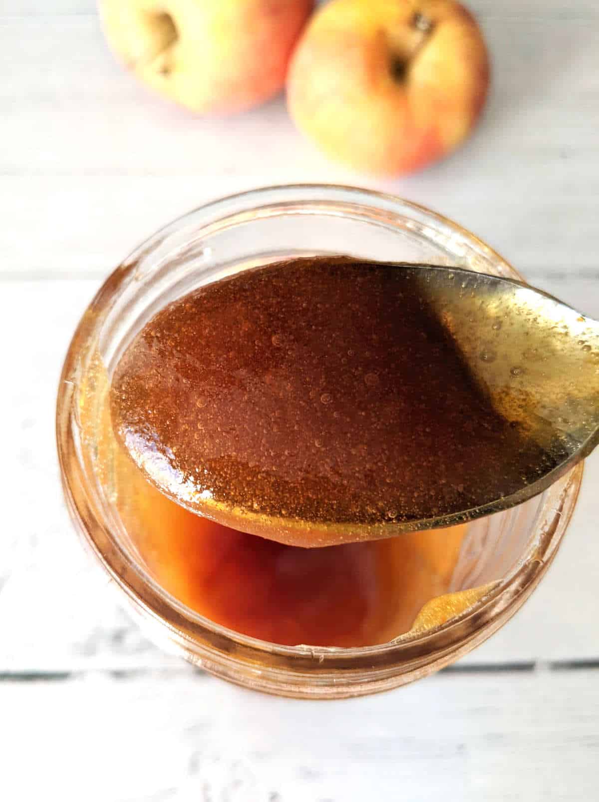 Spoon full of vegan apple honey.