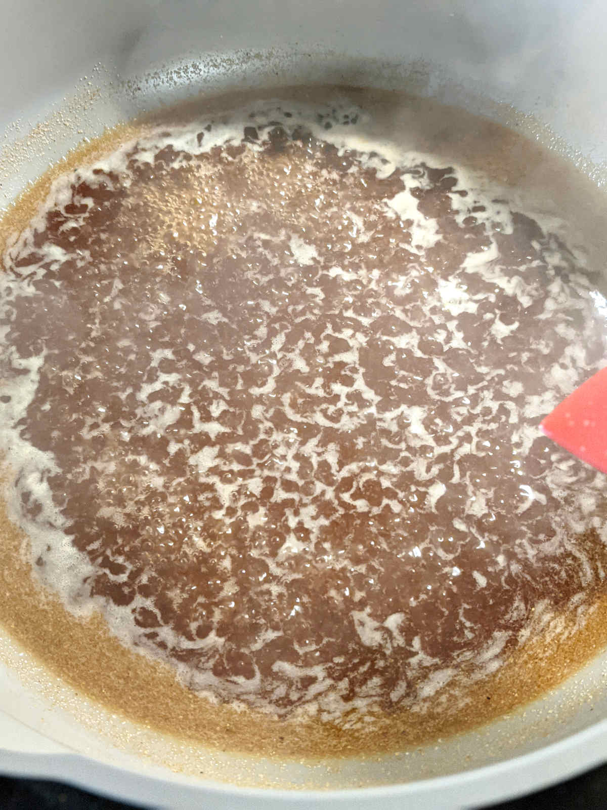 Tempeh marinade boiling in a skillet.