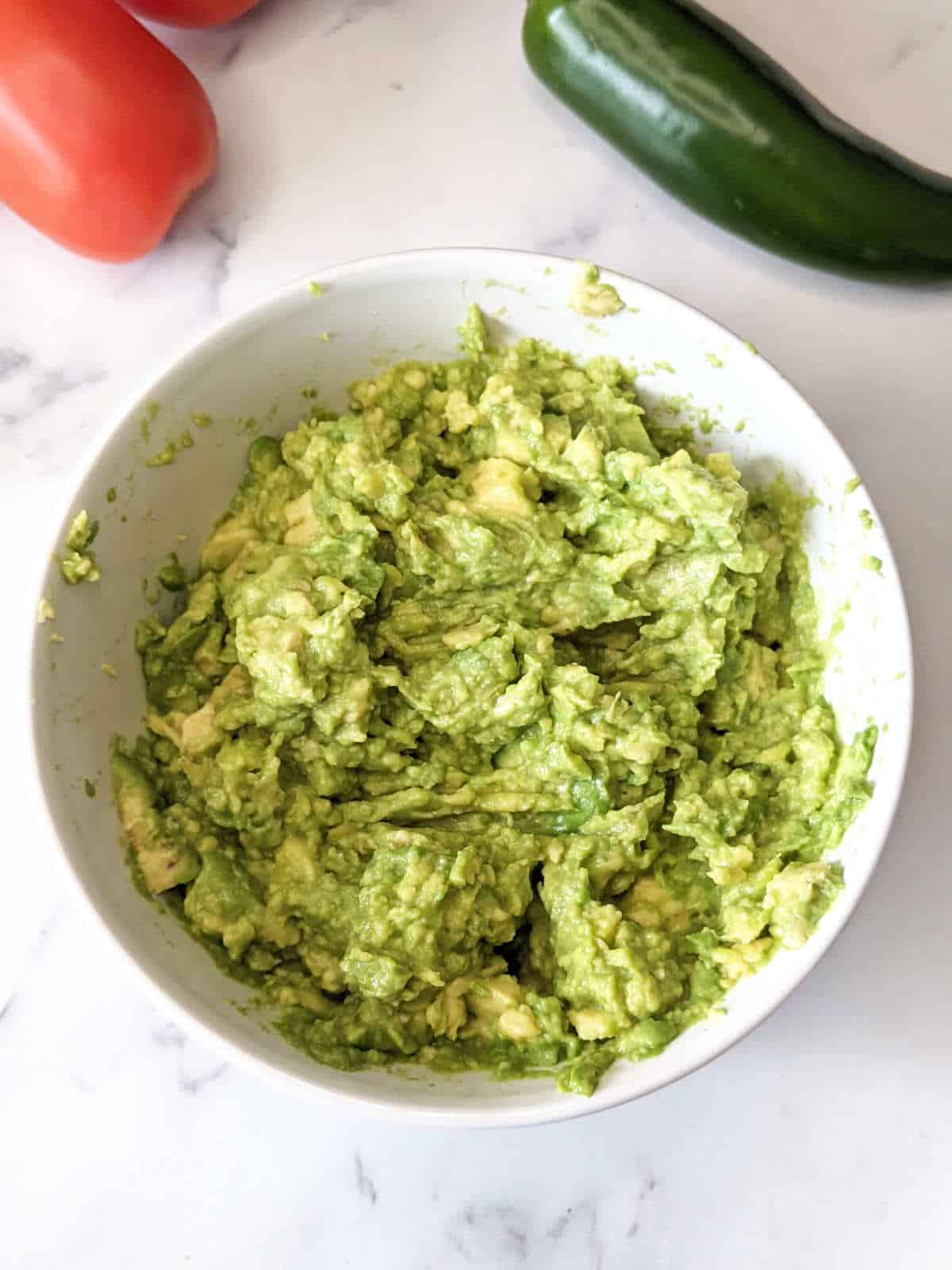 Mashed avocado in a bowl.