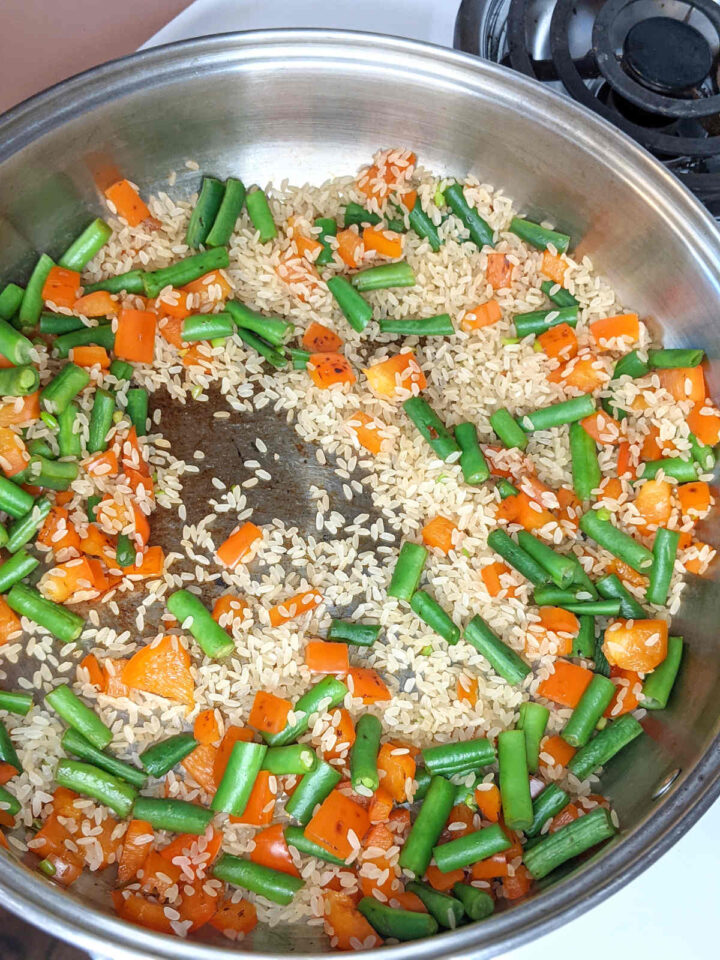Vegetables and rice in pan.
