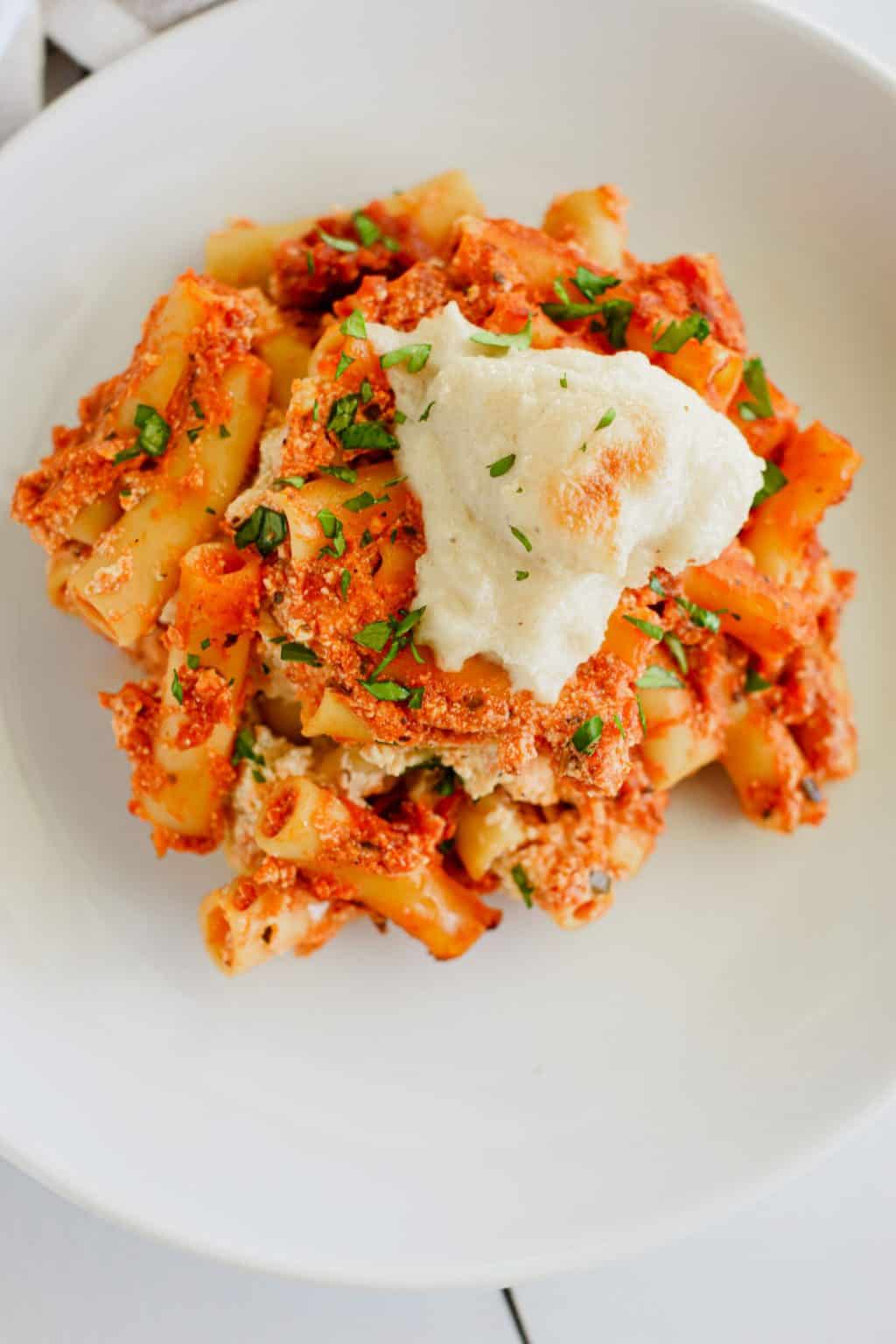 A serving of baked ziti on a plate.