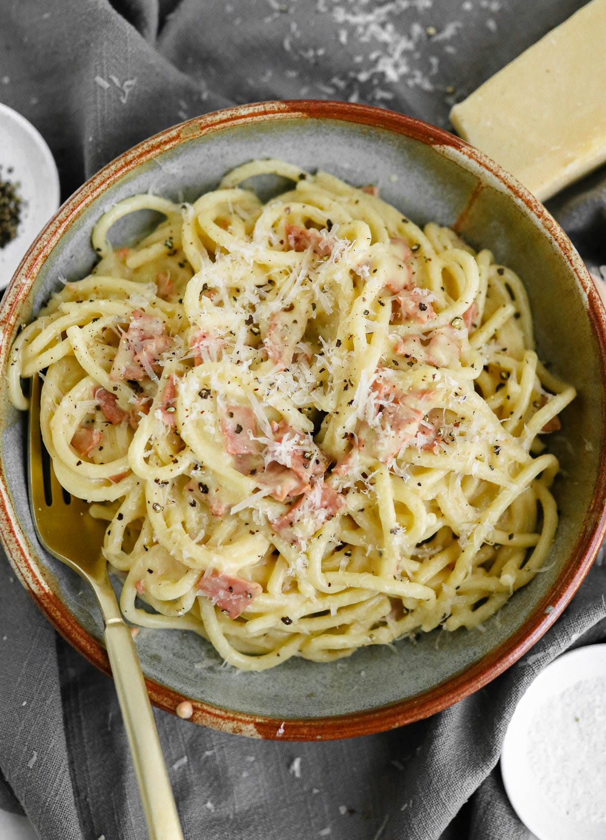 Vegan carbonara in a bowl with a fork.