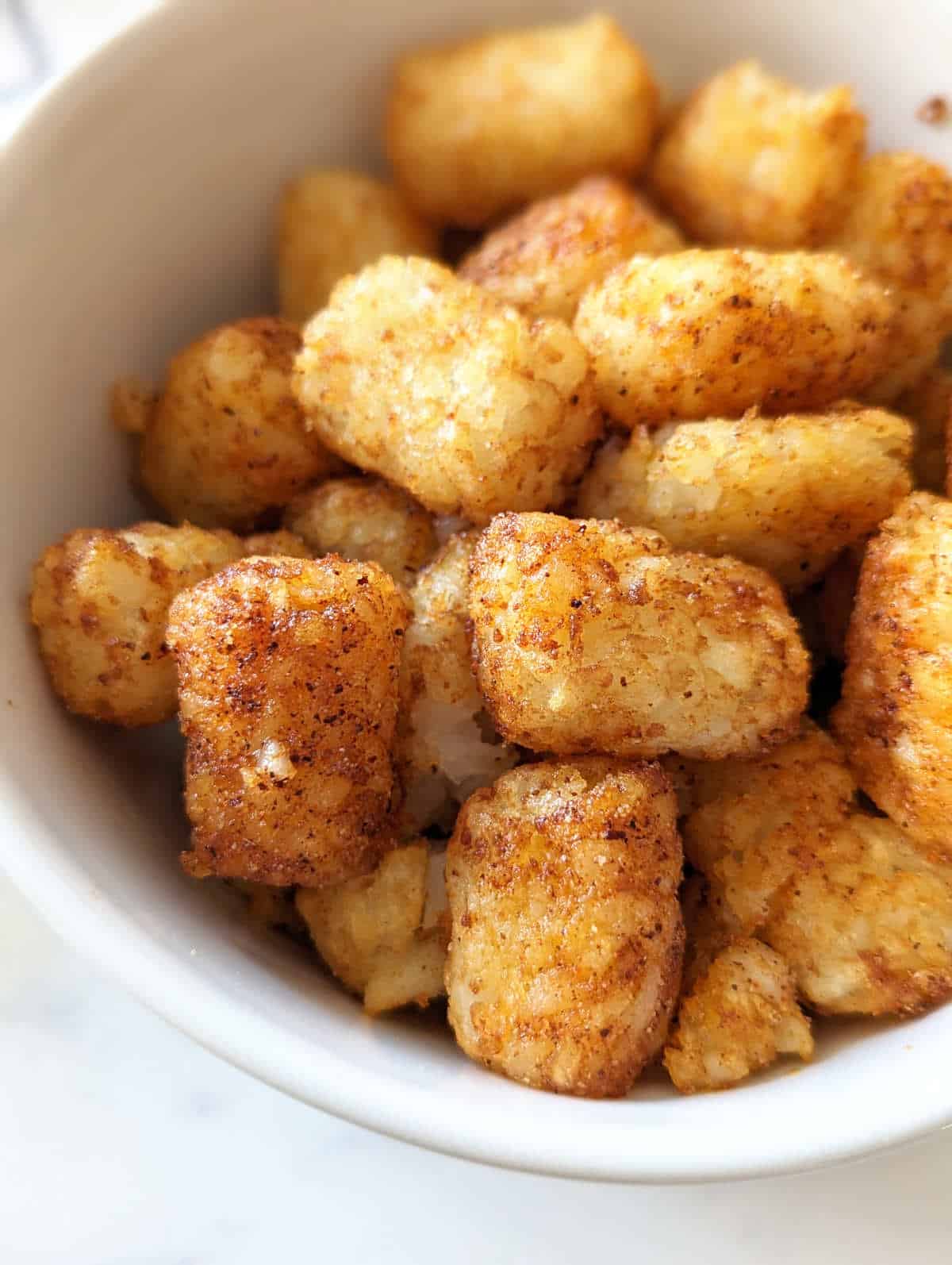 Air fried tater tots after tossing in a little oil and seasonings.
