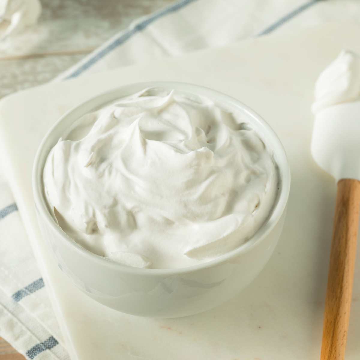 Bowl of homemade coconut whipped cream.