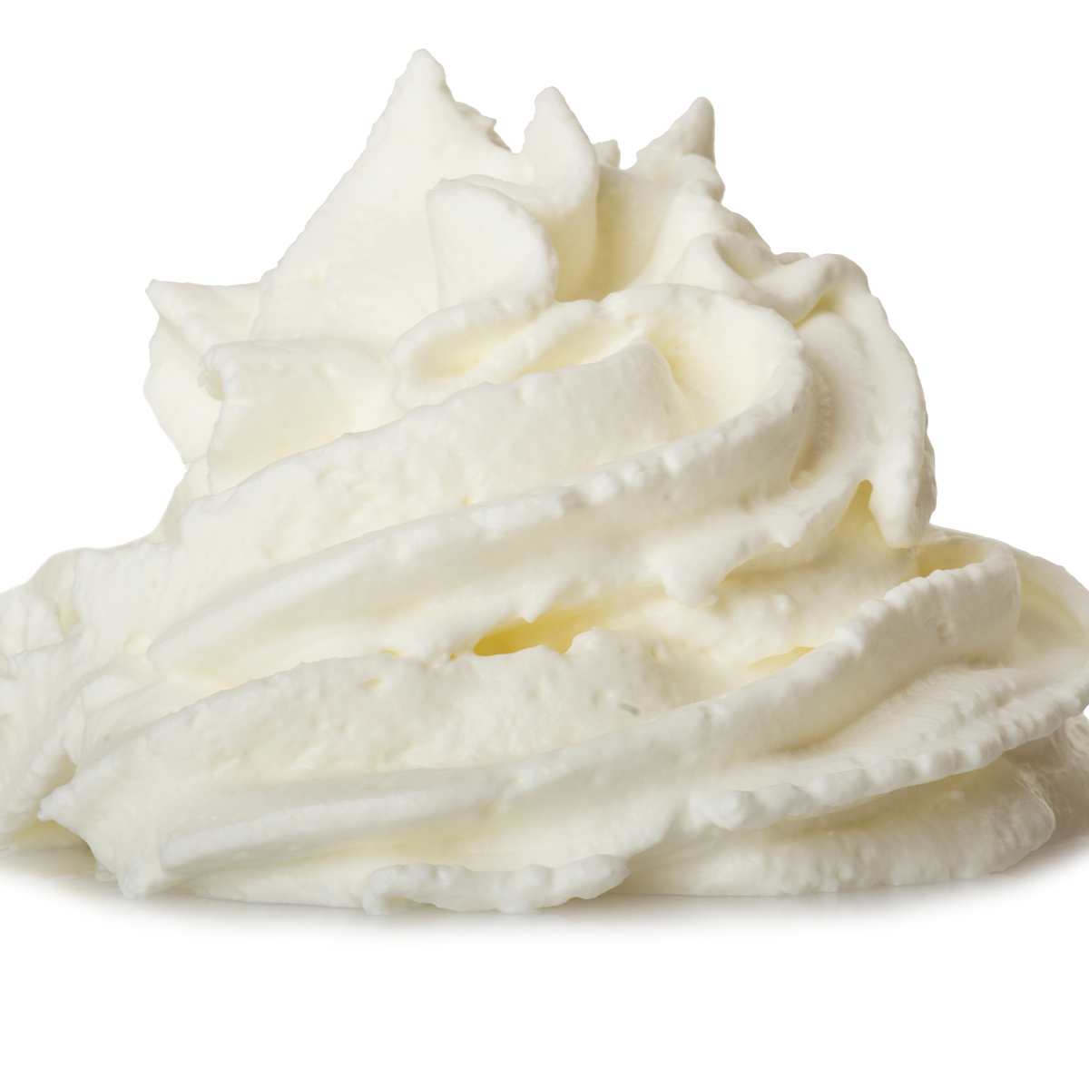Whipped cream swirled on a white background.