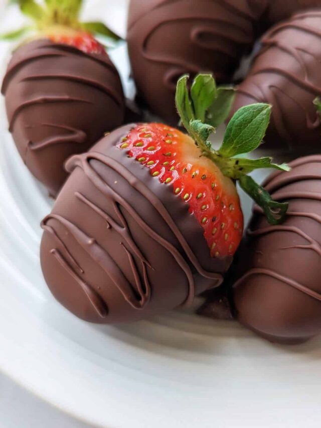 Vegan chocolate covered strawberries on a plate.