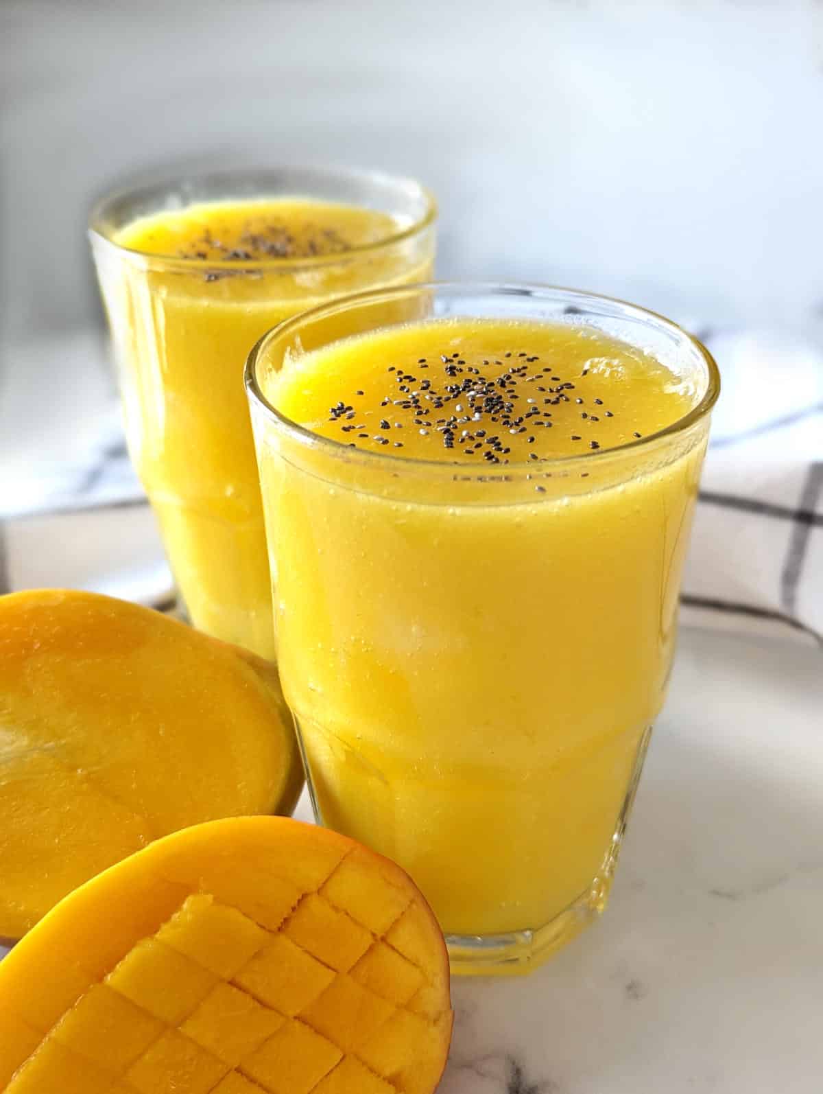 Two glasses of mango juice.