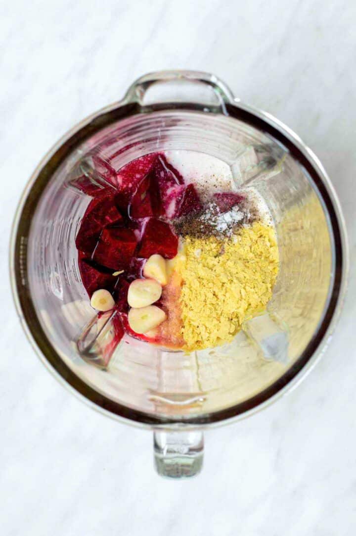 Ingredients for beet sauce added to a blender.