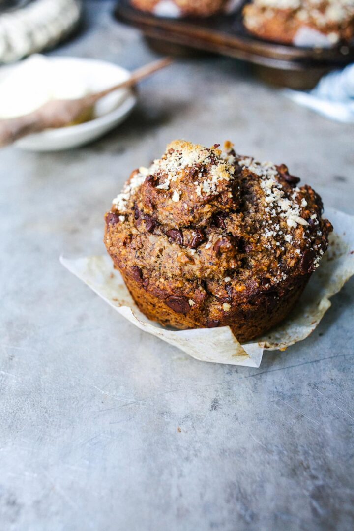 Vegan buckwheat banana muffin on a piece of parchment paper.