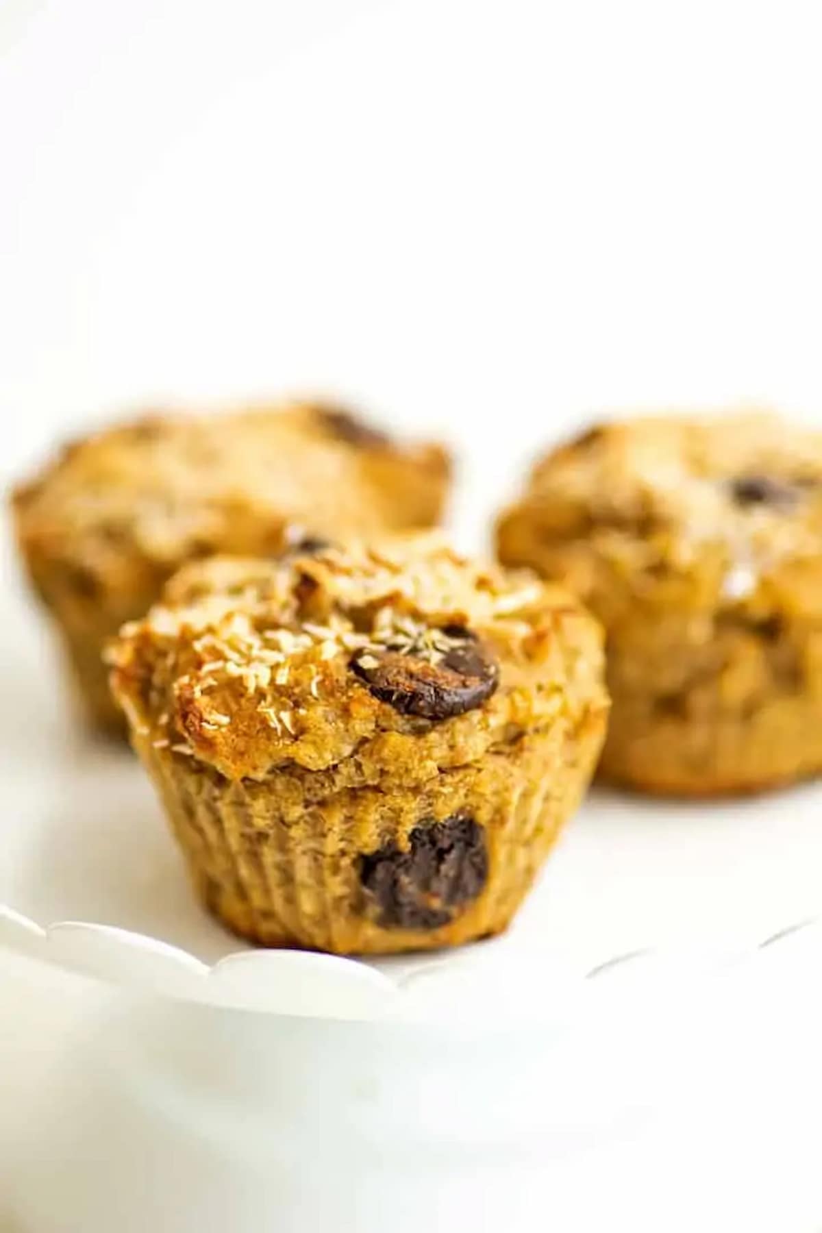 Quinoa banana muffins topped with shredded coconut.