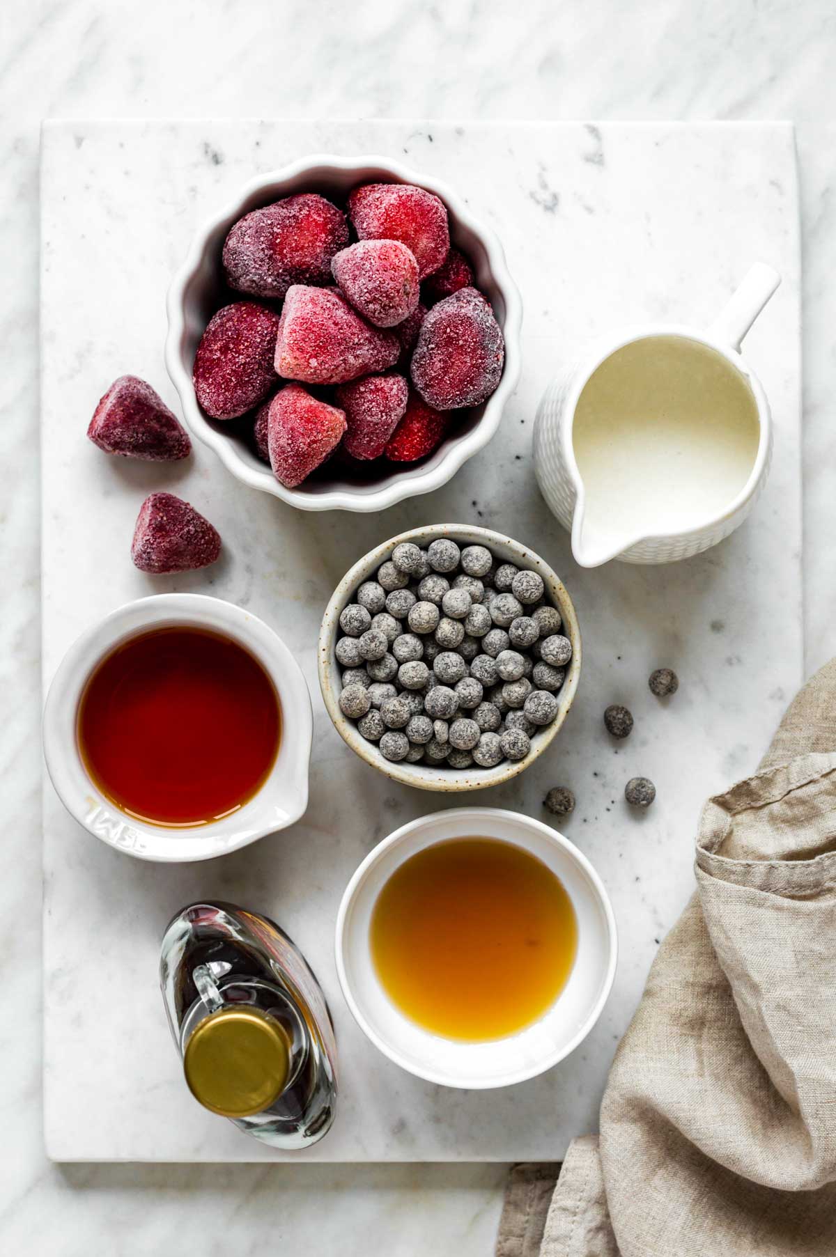 Gathered ingredients for making strawberry bubble tea.