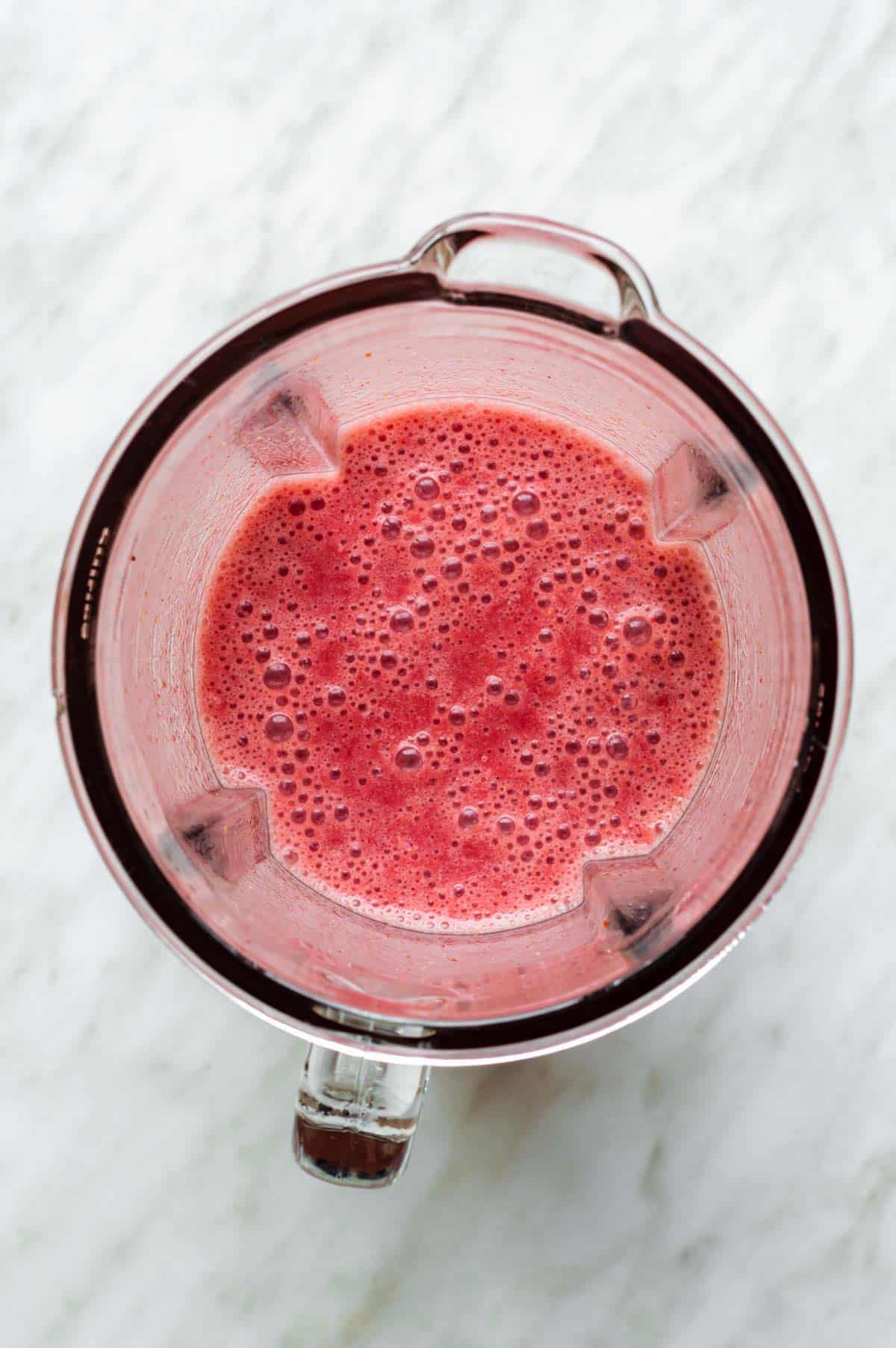 Strawberry smoothie in a blender.