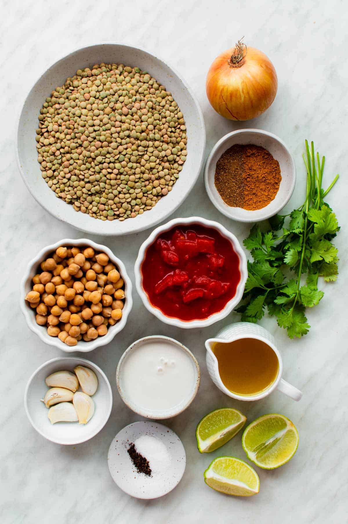Gathered ingredients for making chickpea and lentil curry.