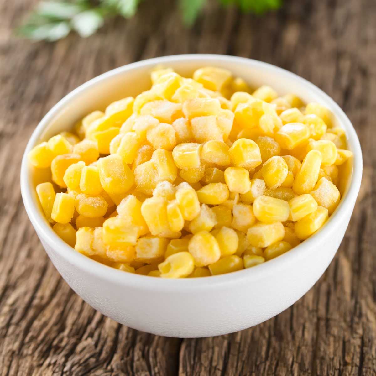 A bowl of frozen whole kernel corn.