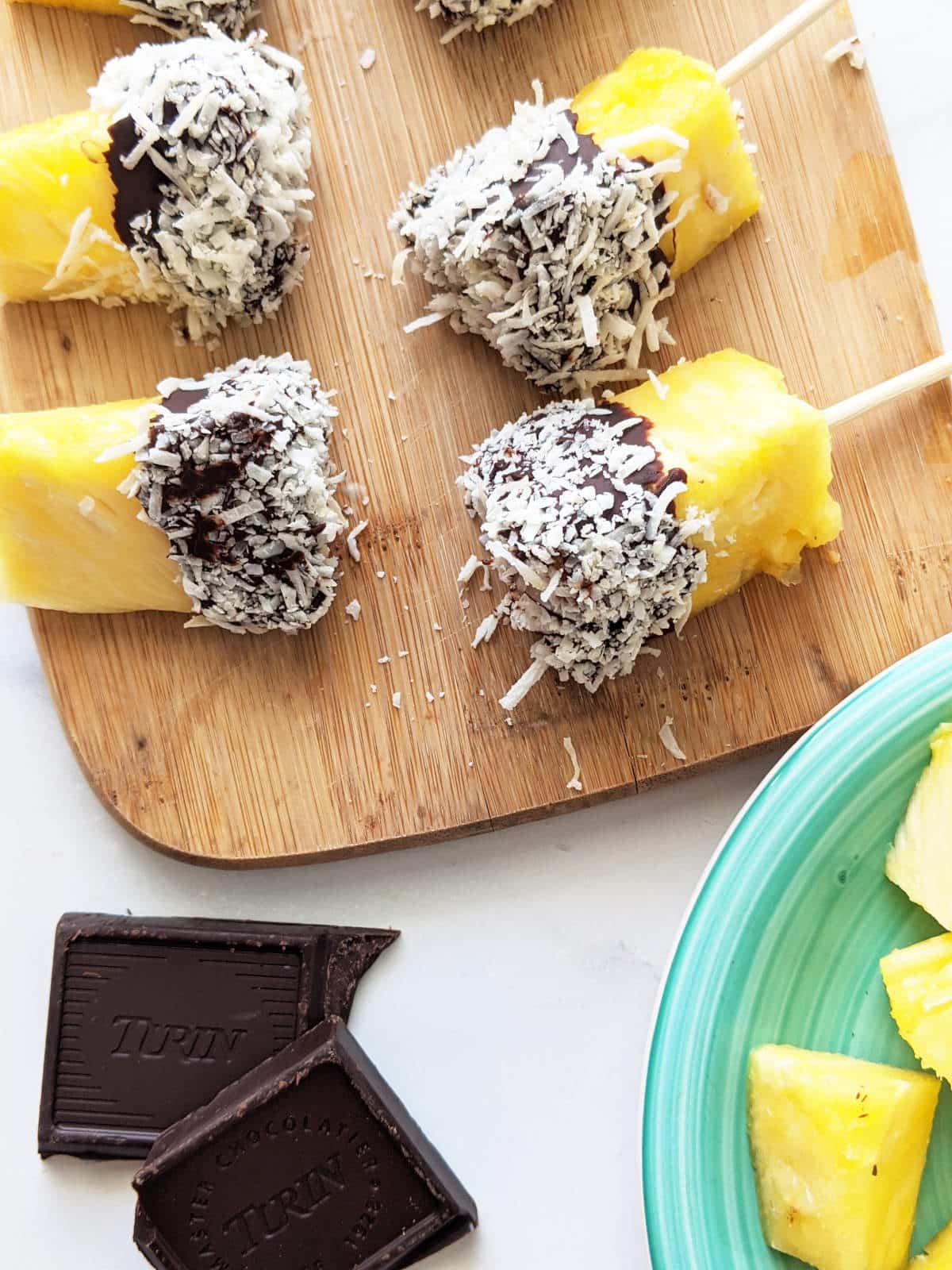 Chocolate covered pineapple on a serving platter.