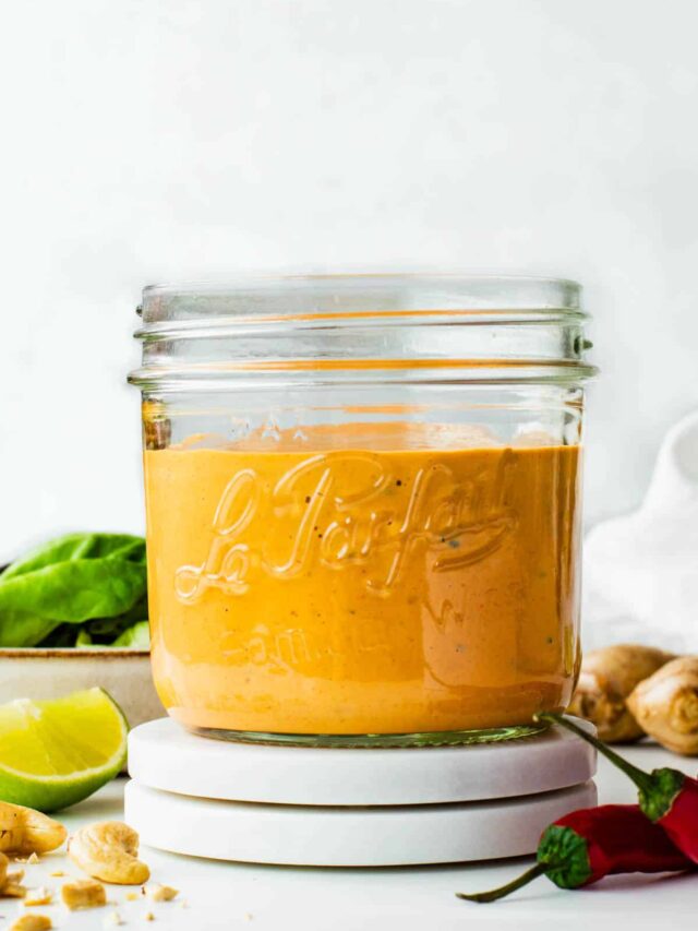 Spicy cashew dressing in a glass jar.