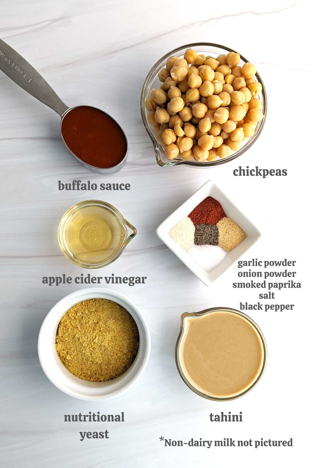 Gathered ingredients for this buffalo chickpea dip with labels.