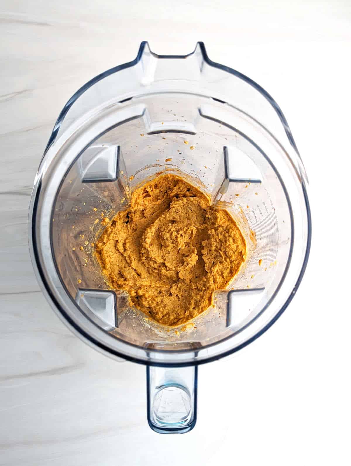 The blended buffalo chickpea dip in a blender pitcher.