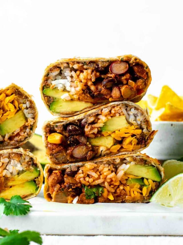 A stack of chili cheese burritos on a plate.