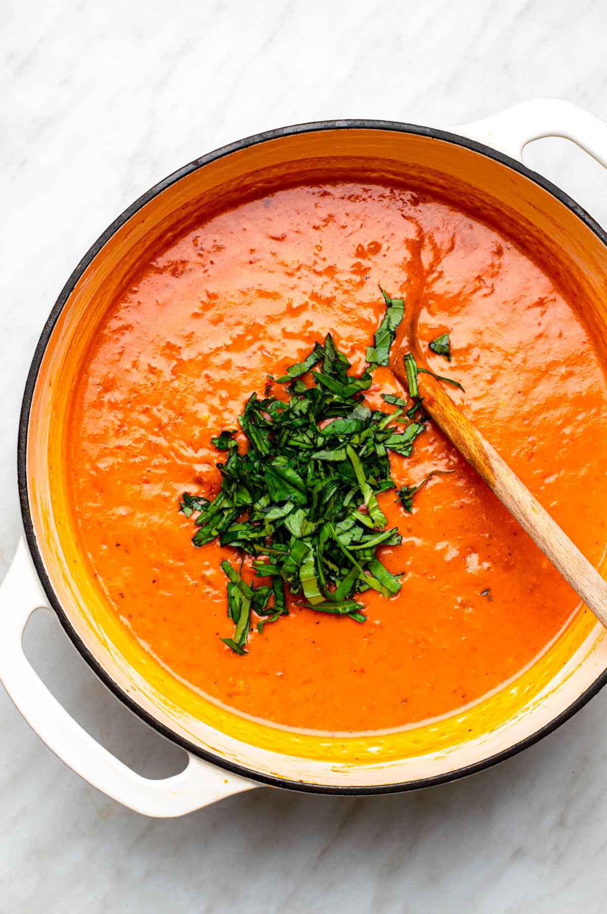 Fresh basil leaves added to the coconut milk pasta sauce.