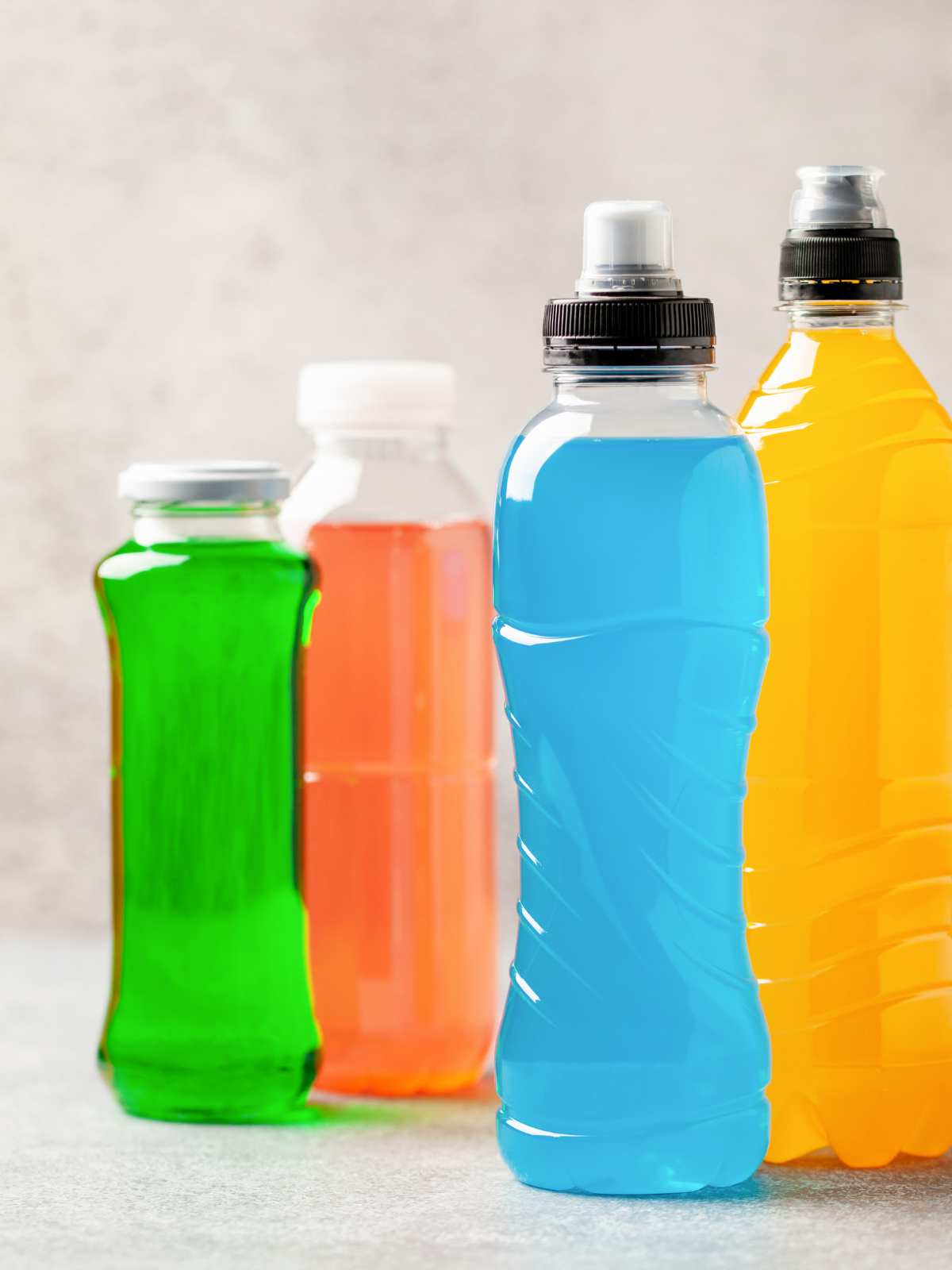 Various sports drinks in different bottles.