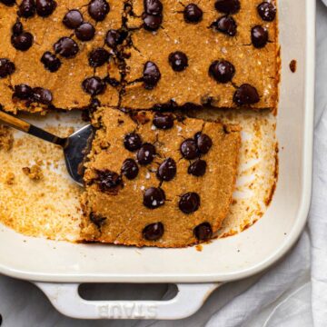 A baking dish of baked oats without banana cut into slices.