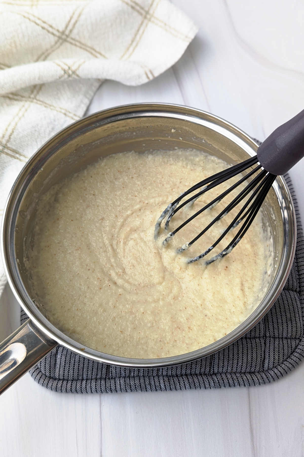 Cream of wheat in a small saucepan with plant-based milk.