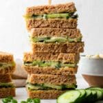 A stack of vegan cucumber sandwiches.