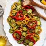 Bell pepper cucumber salad served on a white plate.