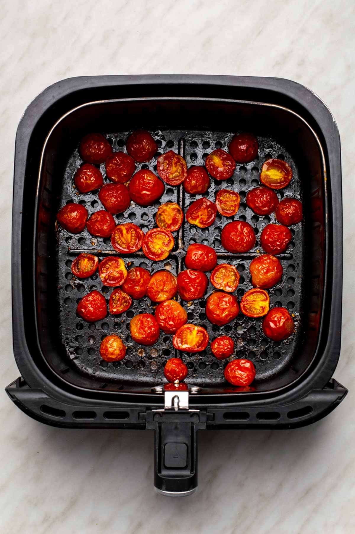 Air-fried halved tomatoes with a lightly roasted appearance.