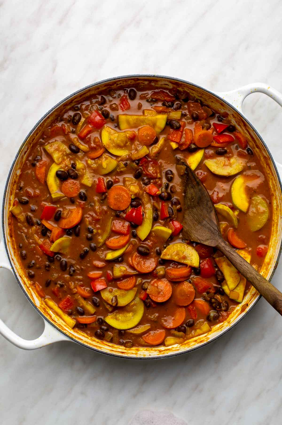Spinach or kale stirred into black bean curry until wilted, finished with fresh lime juice and salt to taste.