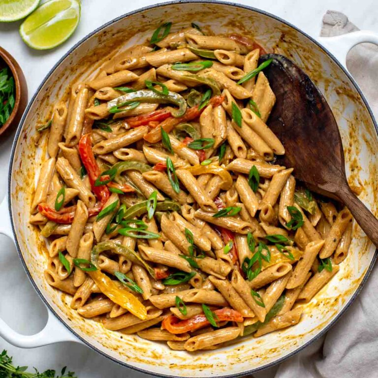 Vegan Rasta Pasta served hot and topped with scallions and thyme.