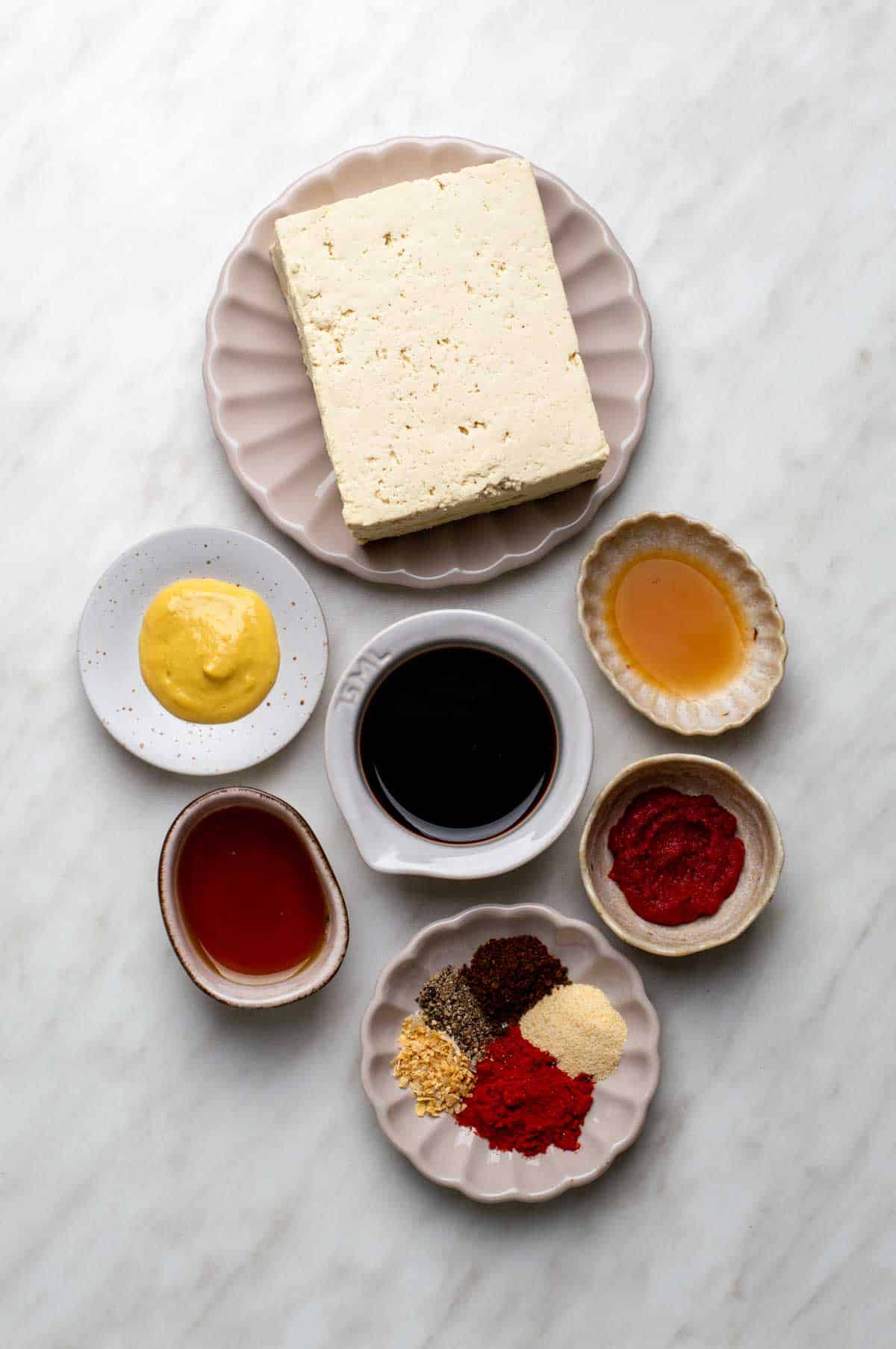 The gathered ingredients for this vegan ham recipe, measured into individual bowls.