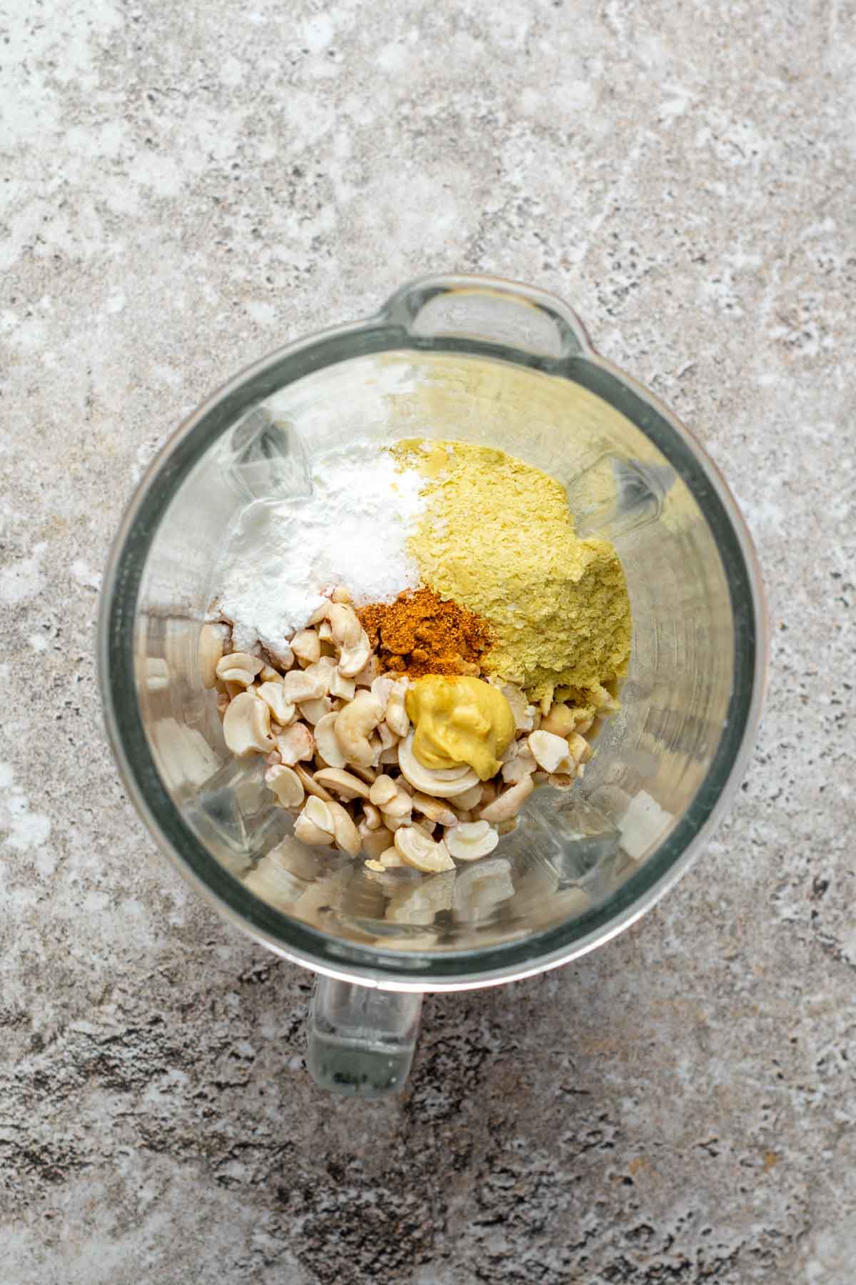 Béchamel ingredients in a high-speed blender ready to be blended.